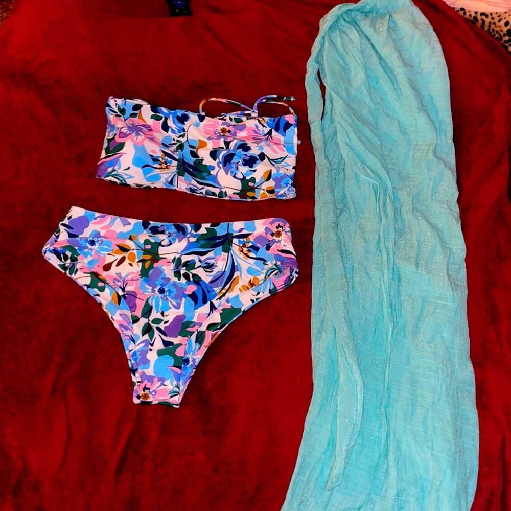 BRAND NEW BATHING SUIT. Along with a wrap coverup